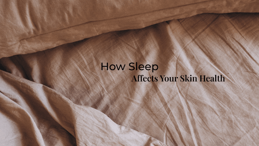 Soft, beige bed linen with natural folds, symbolizing rest and its impact on skin recovery and nighttime skincare routines.